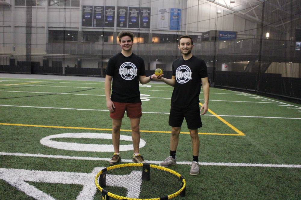 Students wearing championship shirts from a spikeball tournament on Tuesday